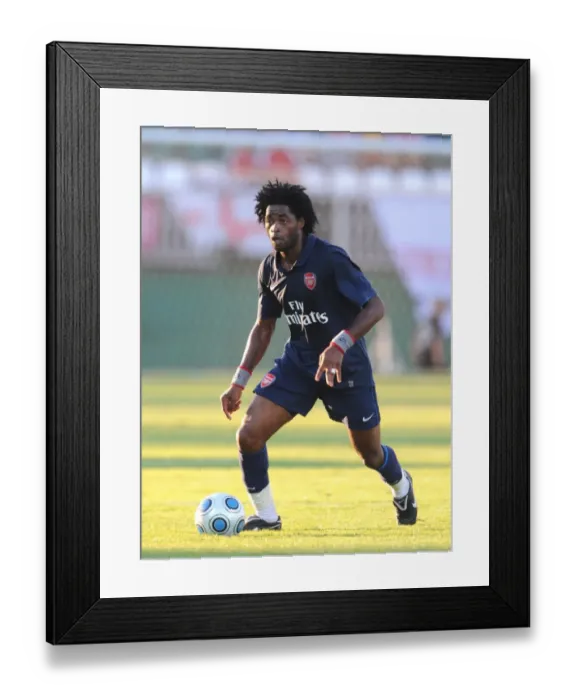 Framed Print : Alex Song's Dominant Display: Arsenal's 5-0 Pre-Season Thrashing of Szombathelyi, July 2009