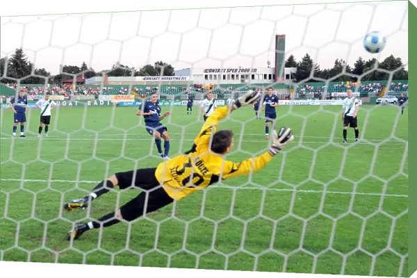 Robin van Persie shoots past Szombathelyi goalkeeoer