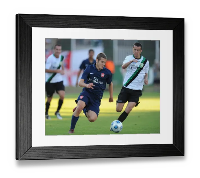 Framed Print : Jack Wilshere (Arsenal) Bence Iszlia (Szombathelyi)