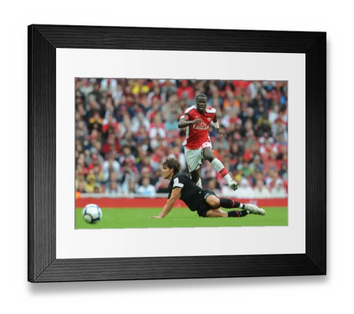 Framed Print : Arsenal's Eboue vs. Dominguez: A Battle at the Emirates Cup, 2009