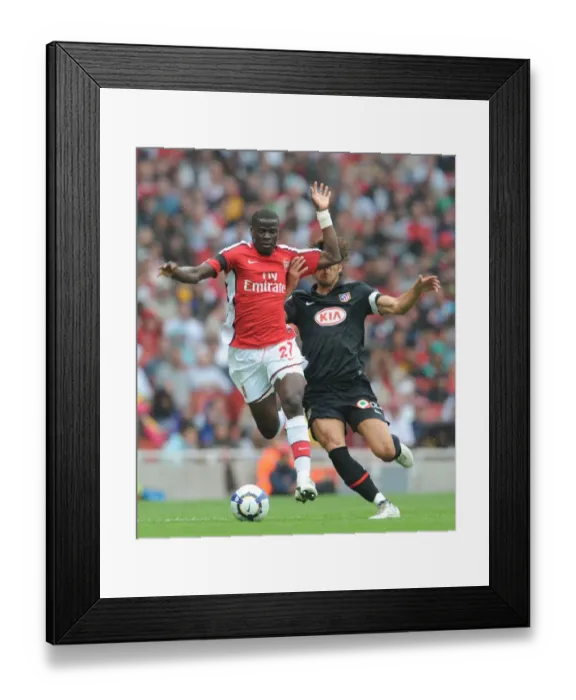 Framed Print : Arsenal's Eboue vs. Athletico's Dominguez: A Clash at the Emirates Cup, 2009 Framed Print : Arsenal's Eboue vs. Athletico's Dominguez: A Clash at the Emirates Cup, 2009