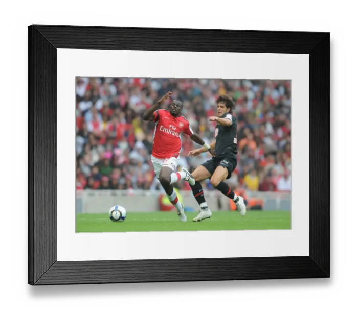 Framed Print : Eboue vs. Dominguez: A Clash at the Emirates Cup, 2009: Arsenal's Victory over Athletico Madrid (2-1) Framed Print : Eboue vs. Dominguez: A Clash at the Emirates Cup, 2009: Arsenal's Victory over Athletico Madrid (2-1)