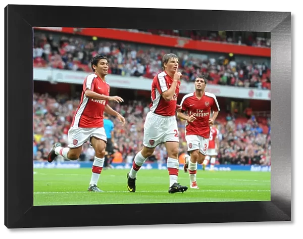 Arsene Wenger's Men: Arshavin, Eduardo, and Merida Celebrate Arsenal's First Goal Against Athletico Madrid, Emirates Cup 2009