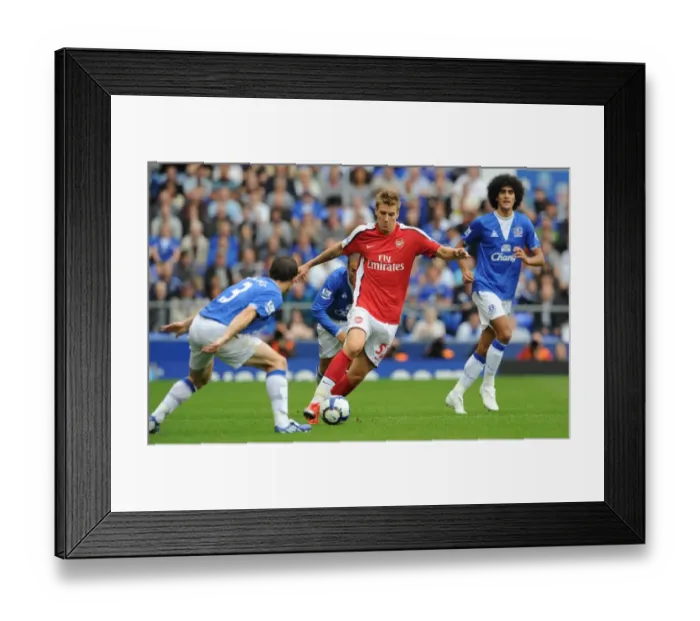 Framed Print : Arsenal's Dominance: Bendtner Scores Six Against Everton's Baines and Fellaini