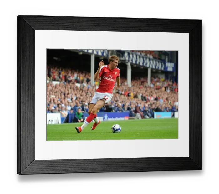 Framed Print : Arsenal's Onslaught: Bendtner's Brilliant Performance Leads Arsenal to a 1-6 Victory over Everton in the Premier League
