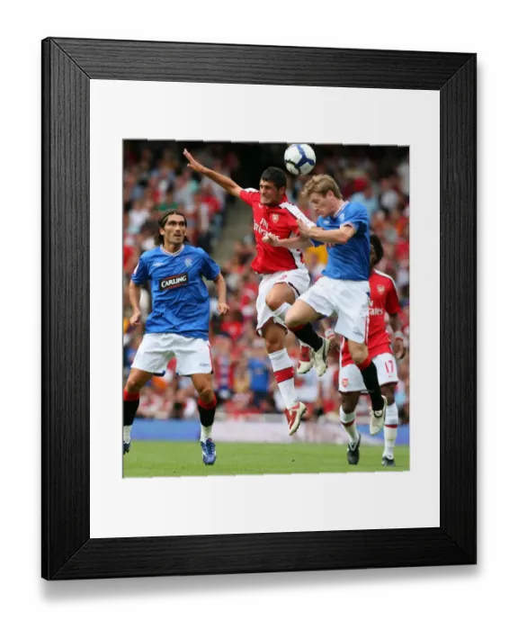 Framed Print : Fran Merida (Arsenal) Steven Davis (Rangers)
