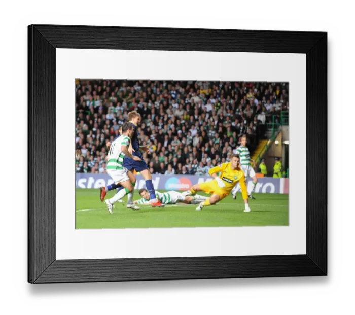 Framed Print : Gary Cladwell puts the ball past Celtic goalkeeper Framed Print : Gary Cladwell puts the ball past Celtic goalkeeper