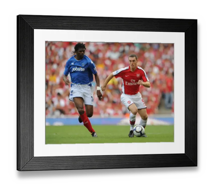 Framed Print : Arsenal's Glory: Vermaelen and Kanu's Unforgettable Victory Celebration (4-1 vs Portsmouth, 2009)