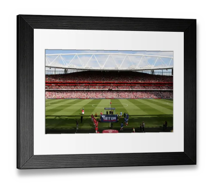 Framed Print : Arsenal and Portsmouth team walk out before the match