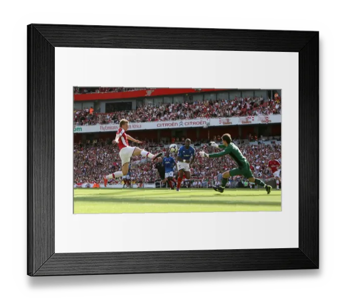Framed Print : Arsenal's Bendtner Scores Twice in 4-1 Premier League Victory over Portsmouth and Asmir Begovic