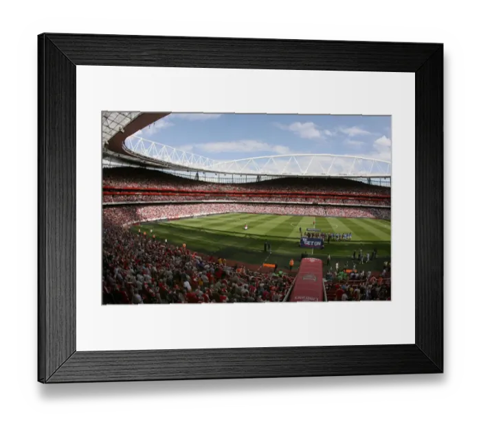 Framed Print : The Arsenal and Portsmouth teams shake hands before the match