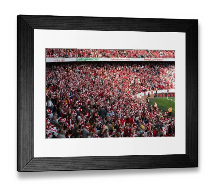 Framed Print : Arsenal Fans Unite: Scarves Raised in Triumph at Emirates Stadium (4:1 Win over Portsmouth, Barclays Premier League, 2009)