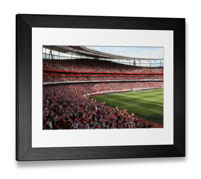 Framed Print : Arsenal fans hold up their scarves before the match Framed Print : Arsenal fans hold up their scarves before the match