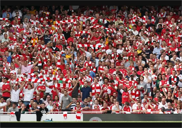 Arsenal Fans Celebrate 4:1 Victory Over Portsmouth in the Barclays Premier League at Emirates Stadium