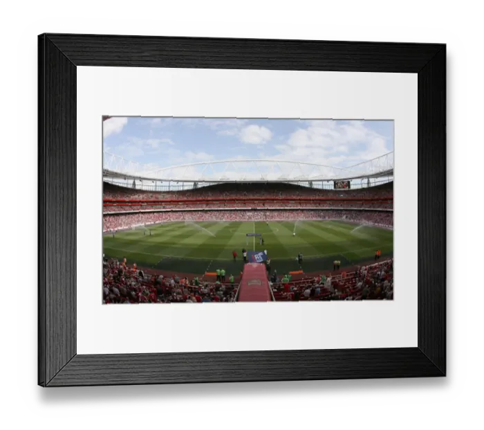 Framed Print : The pitch is watered before the match