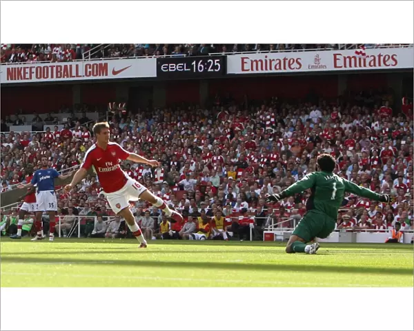 Aaron Ramsey scores Arsenals 4th goal past David James (Portsmouth)
