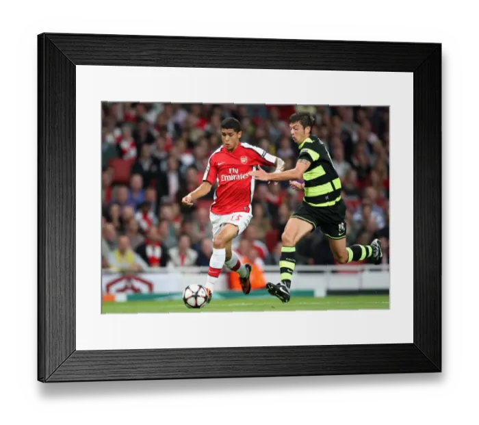Framed Print : Denilson vs. Donati: Arsenal's Triumph Over Celtic in the UEFA Champions League Qualifier (3:1) Framed Print : Denilson vs. Donati: Arsenal's Triumph Over Celtic in the UEFA Champions League Qualifier (3:1)