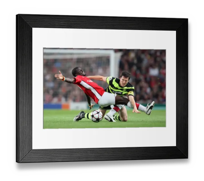 Framed Print : Arsenal's Eboue Shines in 3:1 UEFA Champions League Victory over Celtic's Caldwell