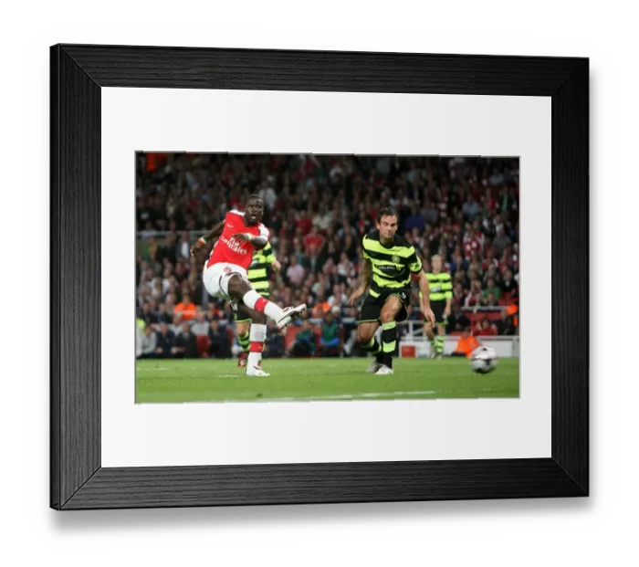 Framed Print : Emmanuel Eboue scores Arsenals 2nd goal under pressure