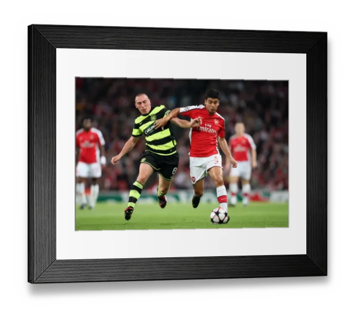 Framed Print : Arsenal's Eduardo and Scott Brown Clash in Intense UEFA Champions League Match: Arsenal 3:1 Celtic (2009) Framed Print : Arsenal's Eduardo and Scott Brown Clash in Intense UEFA Champions League Match: Arsenal 3:1 Celtic (2009)