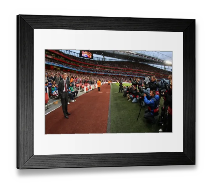 Framed Print : Arsene Wenger the Arsenal Manager stands infront of the photographers Framed Print : Arsene Wenger the Arsenal Manager stands infront of the photographers