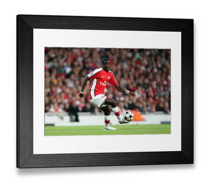 Framed Print : Arsenal's Triumph: Emmanuel Eboue Leads the Way in Arsenal's 3:1 UEFA Champions League Victory over Celtic (2009)