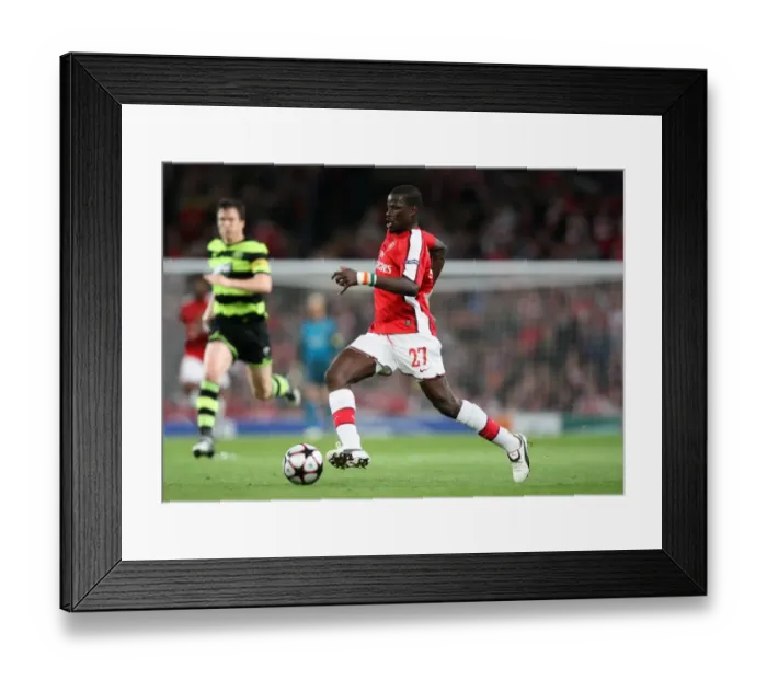 Framed Print : Arsenal's Triumph: Emmanuel Eboue Leads the Gunners to a 3:1 Victory over Celtic in the UEFA Champions League Qualifier (2009)