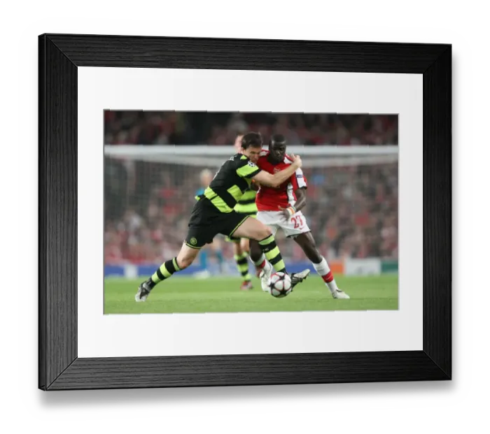 Framed Print : Emmanuel Eboue (Arsenal) Gary Caldwell (Celtic) Framed Print : Emmanuel Eboue (Arsenal) Gary Caldwell (Celtic)