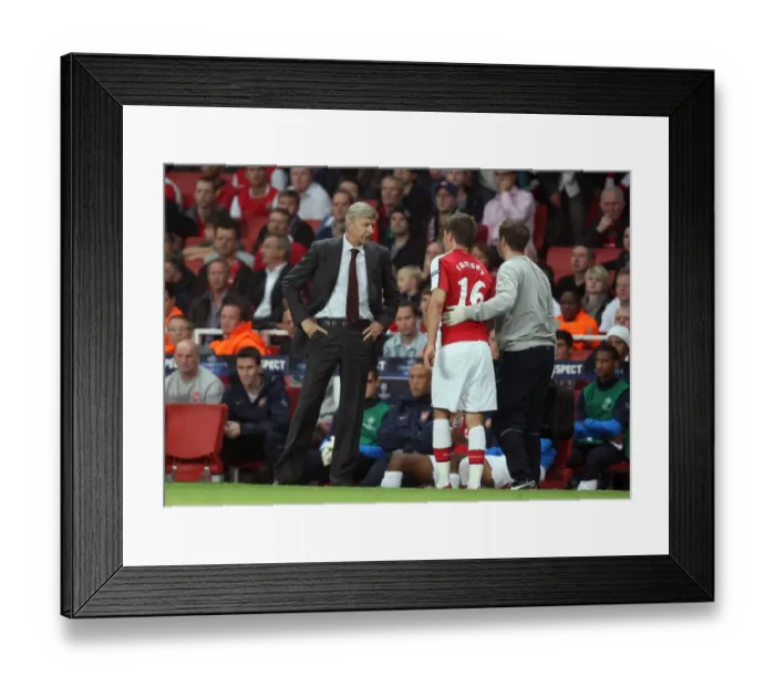 Framed Print : Arsene Wenger the Arsenal Manager chats to Aaron Ramsey Framed Print : Arsene Wenger the Arsenal Manager chats to Aaron Ramsey