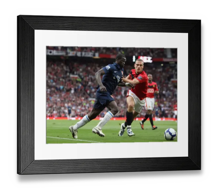 Framed Print : Emmanuel Eboue (Arsenal) Nemanja Vidic (Man Utd) Framed Print : Emmanuel Eboue (Arsenal) Nemanja Vidic (Man Utd)
