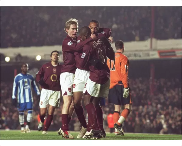 Theirry Henry celebrates scoring Arsenals 1st goal with Kerrea Gilbert and Alex Hleb