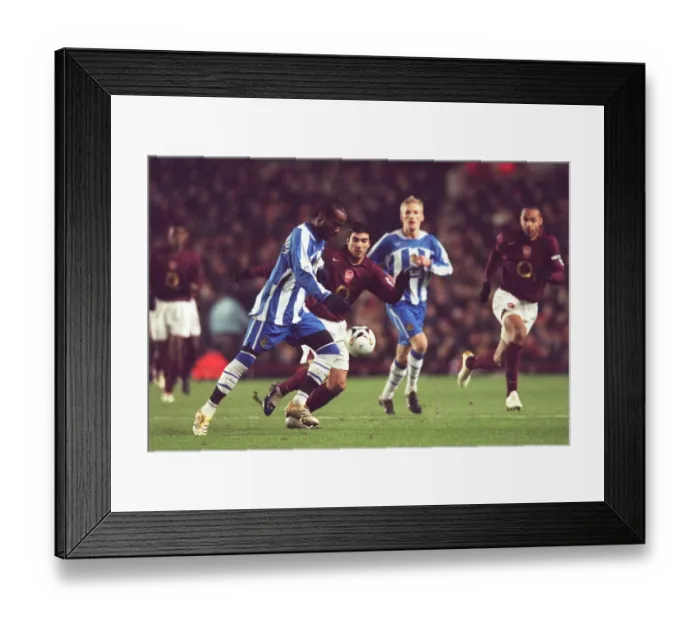 Framed Print : Jose Reyes vs. Pascal Chimbonda: A Battle at the Highbury Carling Cup Semifinal - Arsenal 2:1 Wigan Athletic (2005) Framed Print : Jose Reyes vs. Pascal Chimbonda: A Battle at the Highbury Carling Cup Semifinal - Arsenal 2:1 Wigan Athletic (2005)