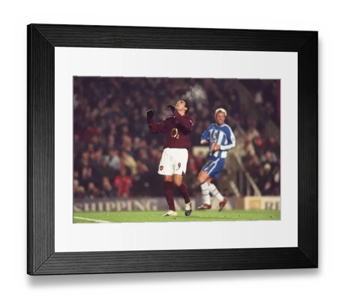 Framed Print : Jose Reyes (Arsenal) after missing his penalty. Arsenal 2: 1 Wigan Athletic Framed Print : Jose Reyes (Arsenal) after missing his penalty. Arsenal 2: 1 Wigan Athletic