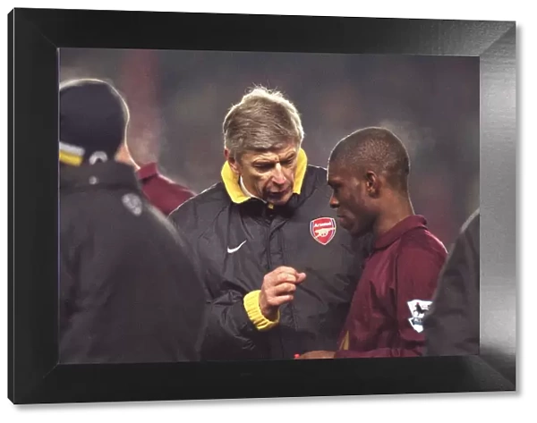 Arsene Wenger the Arsenal manager talks to Kerrea Gilbert (Arsenal) before the start of extra time