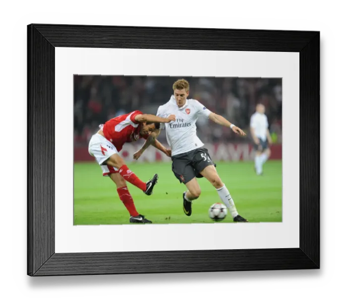 Framed Print : Nicklas Bendtner (Arsenal) Marcos Camozzato (Standard Liege) Framed Print : Nicklas Bendtner (Arsenal) Marcos Camozzato (Standard Liege)