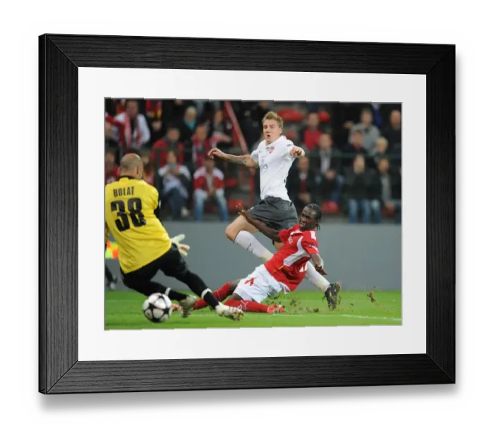 Framed Print : Bendtner Scores the Game-Winning Goal: Arsenal Triumphs 3-2 over Standard Liege in Champions League