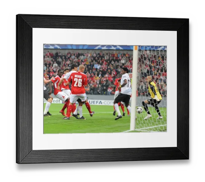 Framed Print : Eduardo celebrates hits the ball past Liege goalkeeper