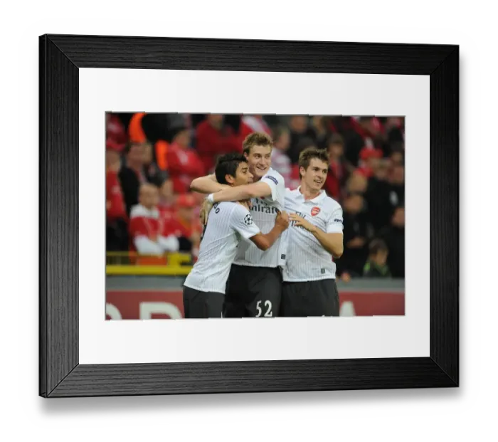 Framed Print : Eduardo, Bendtner, and Ramsey: Celebrating Arsenal's 3rd Goal Against Standard Liege in the UEFA Champions League Framed Print : Eduardo, Bendtner, and Ramsey: Celebrating Arsenal's 3rd Goal Against Standard Liege in the UEFA Champions League