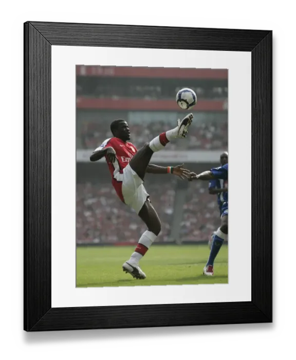 Framed Print : Emmanuel Eboue's Stellar Performance: Arsenal Crushes Wigan Athletic 4-0 in the Premier League