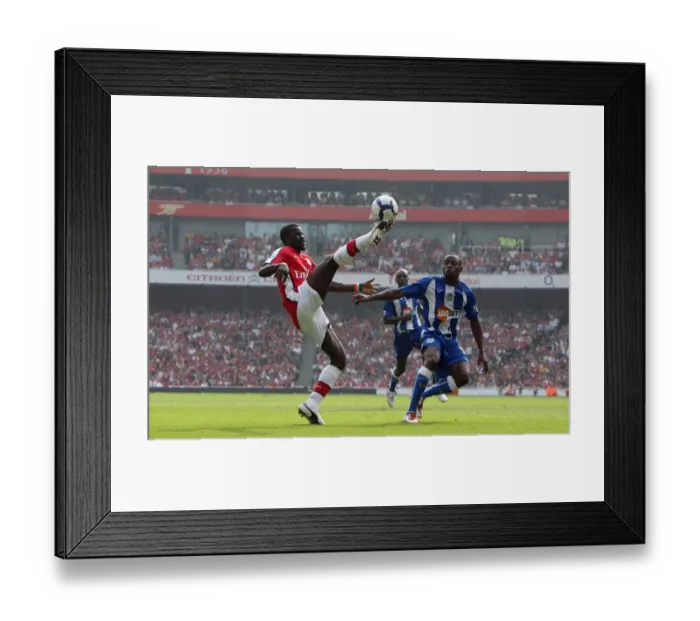 Framed Print : Arsenal's Dominant Performance: 4-0 Over Wigan Athletic featuring Eboue and Figueroa
