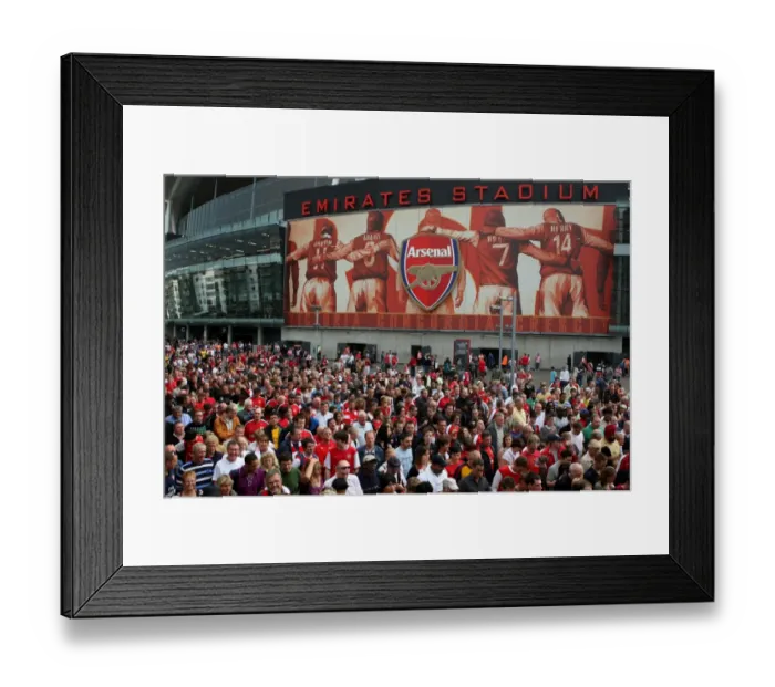 Framed Print : Arsenal fans leave the stadium after the the match