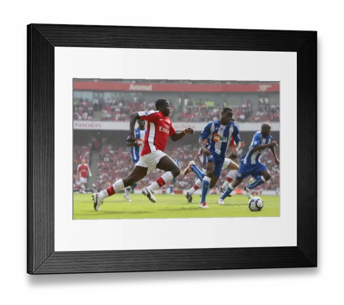 Framed Print : Arsenal's Dominant Display: 4-0 Victory over Wigan with Eboue and Figueroa Framed Print : Arsenal's Dominant Display: 4-0 Victory over Wigan with Eboue and Figueroa