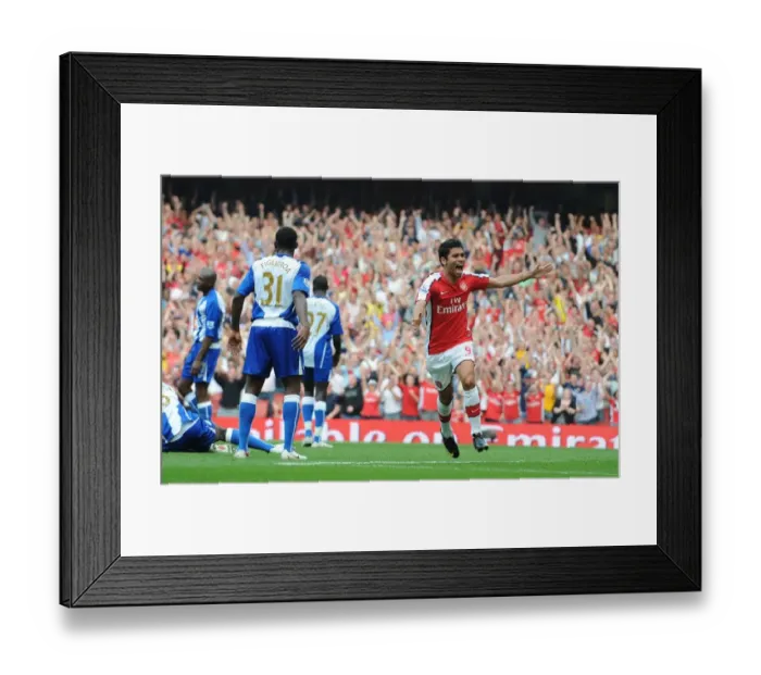 Framed Print : Eduardo's Delight: Emmanuel Eboue Scores Arsenal's Third Goal in 4-0 Victory over Wigan Athletic