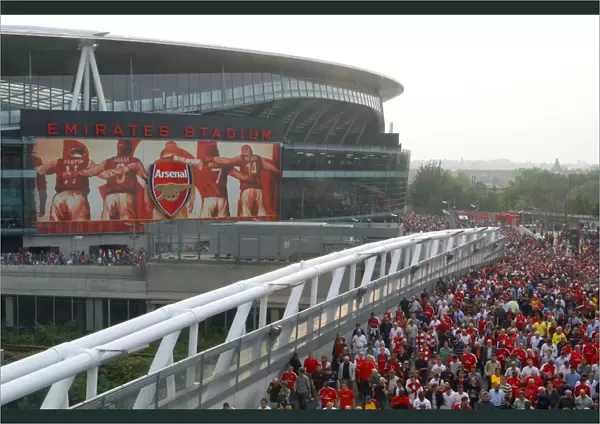 Arsenal fans leave the stadium after the match