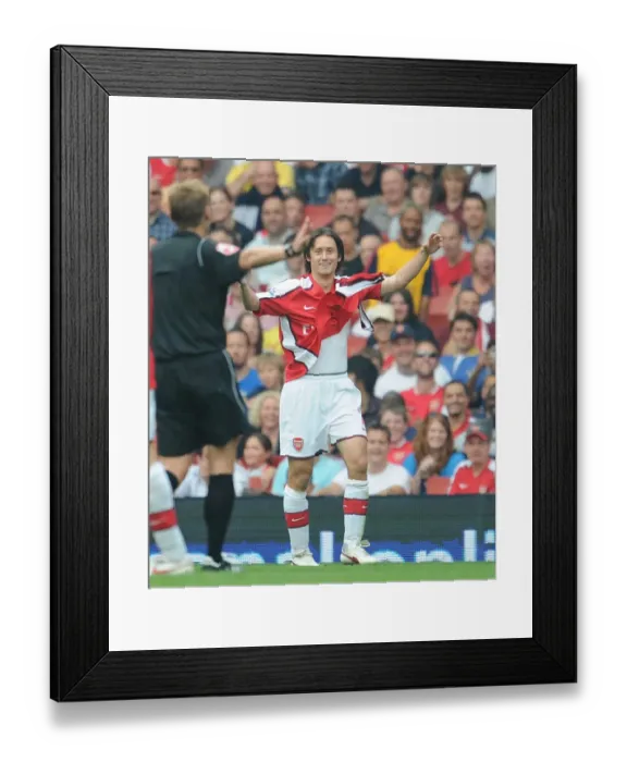 Framed Print : Tomas Rosicky (Arsenal) shows the referee his torn shirt Framed Print : Tomas Rosicky (Arsenal) shows the referee his torn shirt