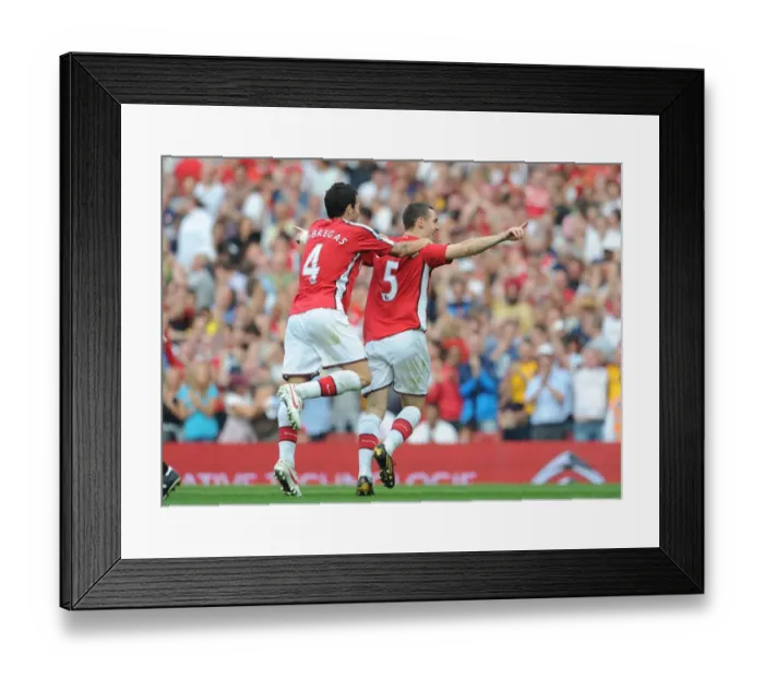 Framed Print : Thomas Vermaelen and Cesc Fabregas: Celebrating Arsenal's 4-0 Goal Against Wigan Athletic, 2009