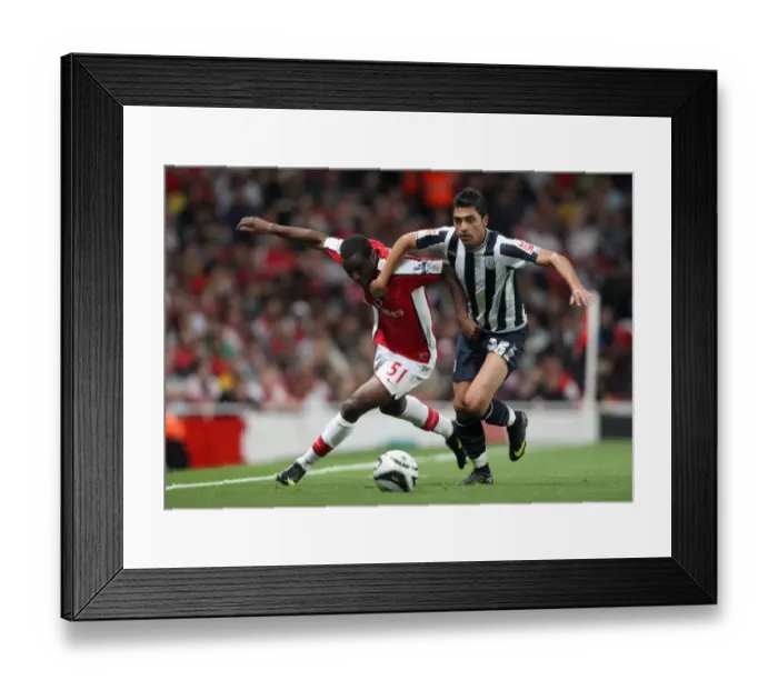 Framed Print : Gilles Sunu (Arsenal) Gonzalo Jara (WBA)