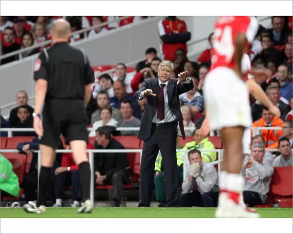 Arsene Wenger the Arsenal Manager appeals for a foul