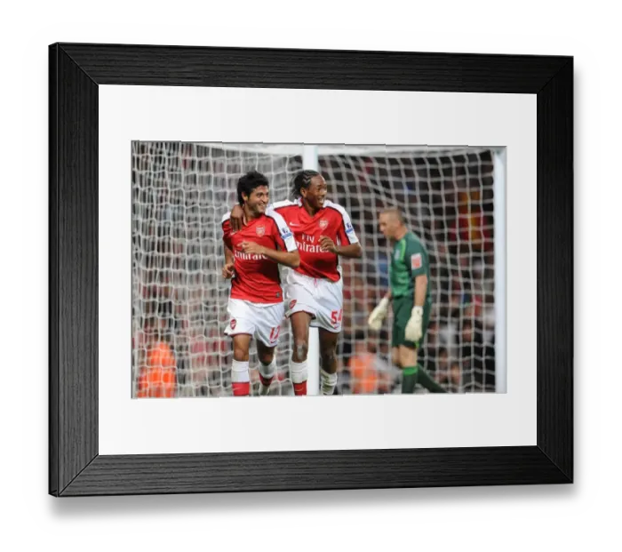 Framed Print : Arsenal's Unstoppable Duo: Carlos Vela and Sanchez Watt's 2-0 Goal Celebration vs. West Brom in Carling Cup Framed Print : Arsenal's Unstoppable Duo: Carlos Vela and Sanchez Watt's 2-0 Goal Celebration vs. West Brom in Carling Cup