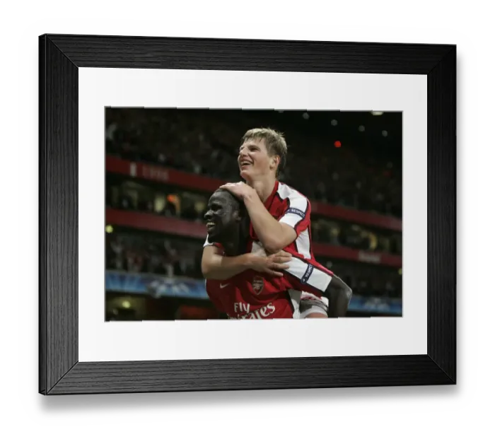 Framed Print : Arshavin and Eboue: Celebrating Arsenal's 2-0 Victory Over Olympiacos in the Champions League
